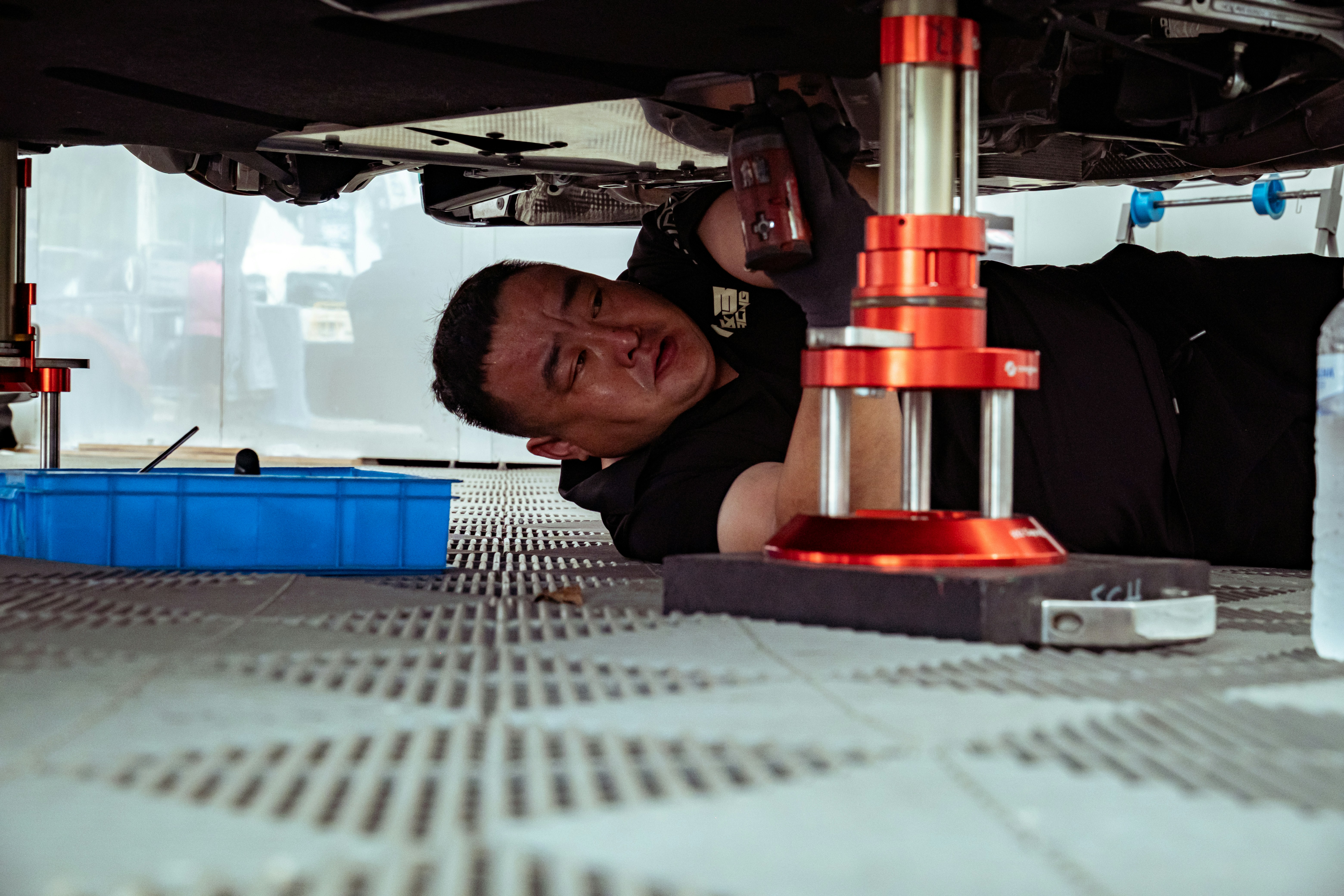 Mechanic working on a vehicle in an auto repair shop